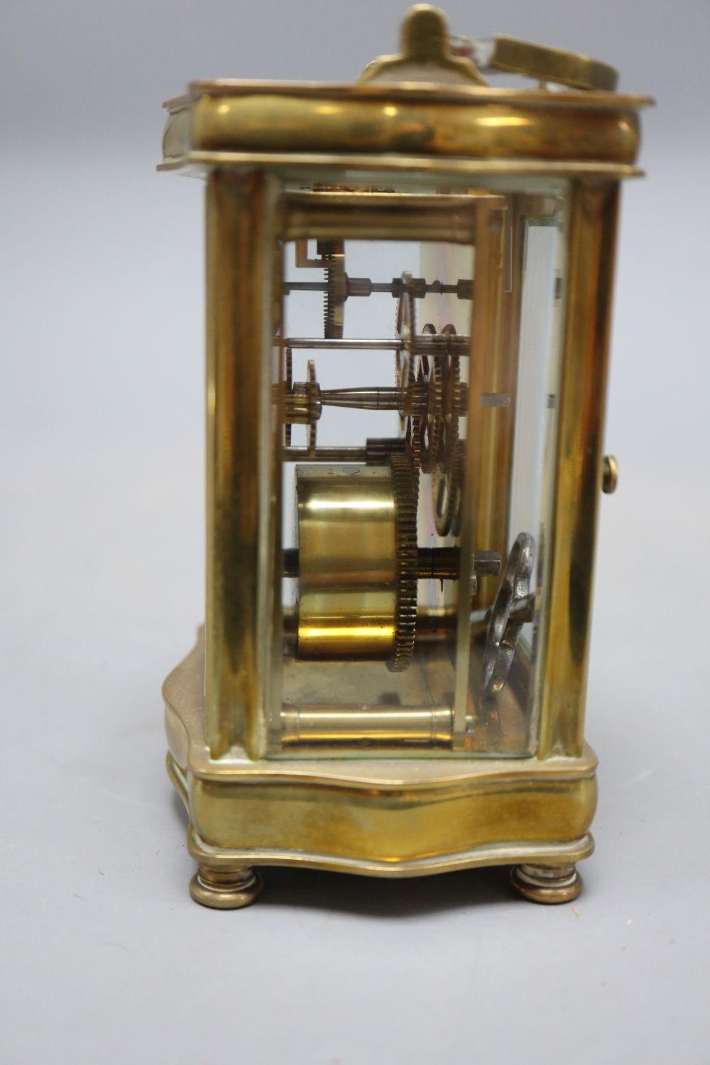 A brass carriage timepiece, height 13cm (handle down)